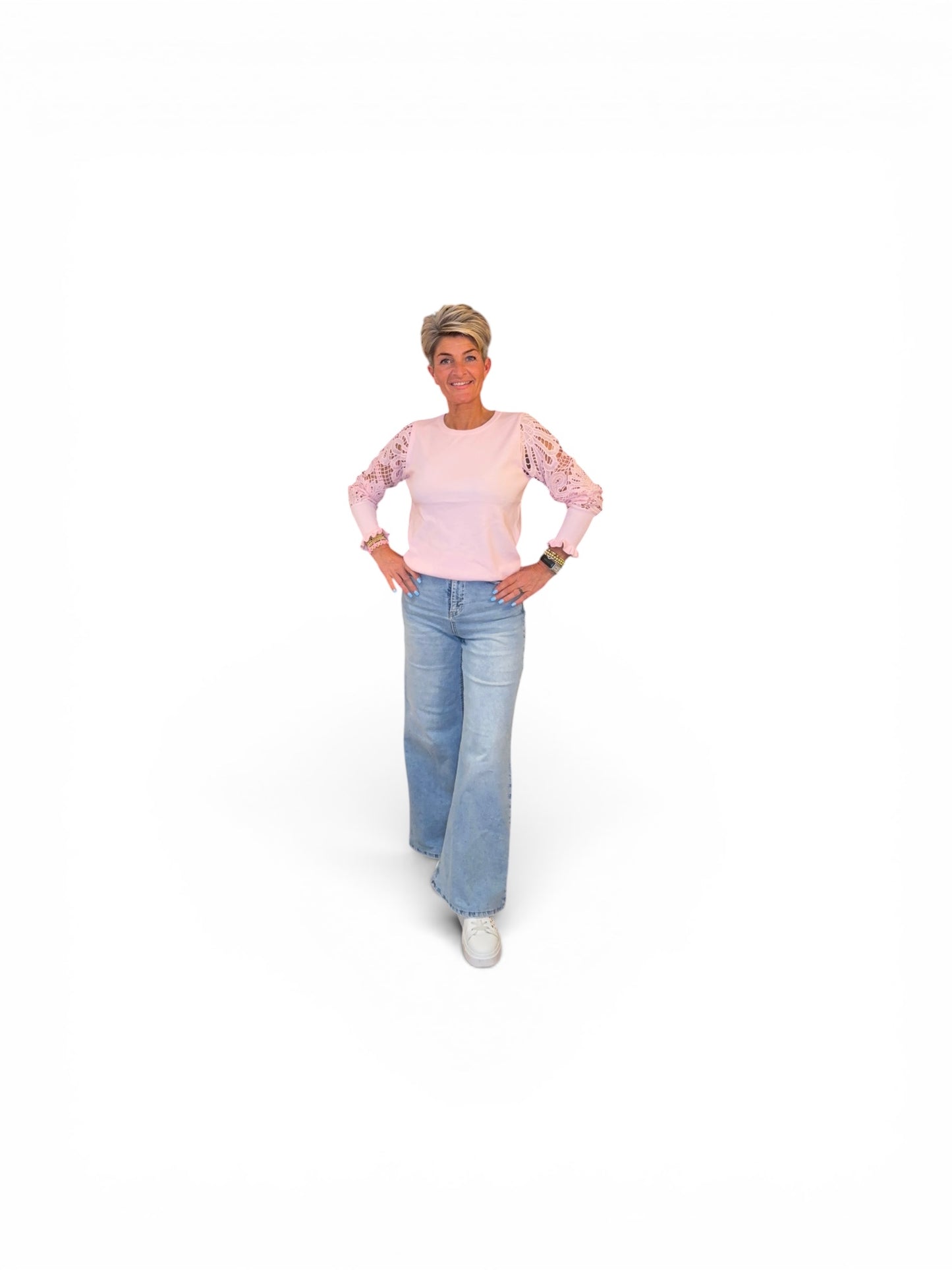 Elegante soft top met opengewerkte mouwen